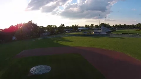 Descending onto baseball field at sunset on a calm evening Stock Footage 40650106