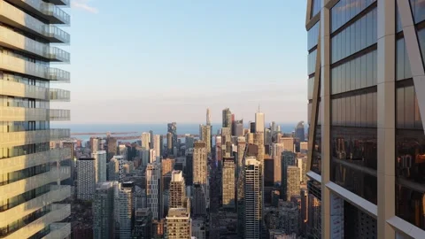Descending between modern office buildings and apartments reveals Toronto's skyl Stock Footage 335225704