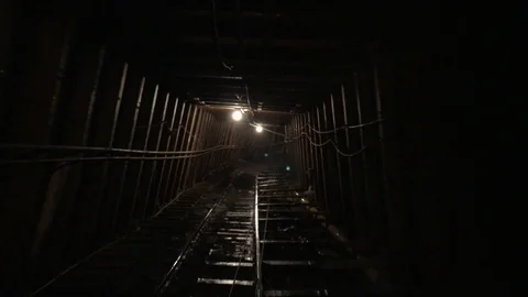 Descending into Coal Mine Tunnel Stock Footage