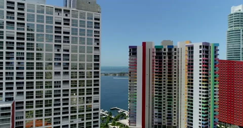 Descending on colorful Miami Condos Stock Footage 157385341