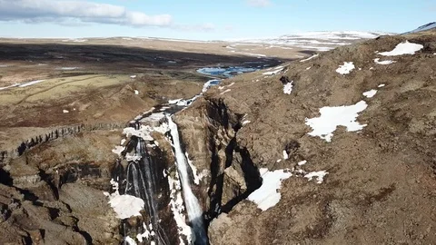 Descending down Haifoss Waterfall lightly covered with snow Stock Footage 95203311