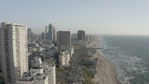 Descending Drone Footage of the coastline in a Mediterranean city Stock Footage