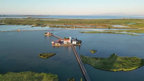 Descending Drone Orbit from Aerial View to Water Level at Porto Lagos Greece Stock Footage 340252362