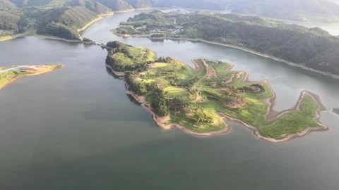 Descending Drone Shot With Camera Tilt Toward a Scenic Island in South Korea Stock Footage 343194158
