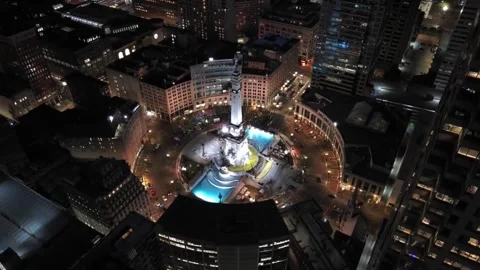 Descending drone shot of Monument Circle, downtown Indianapolis, night Stock Footage 288225837