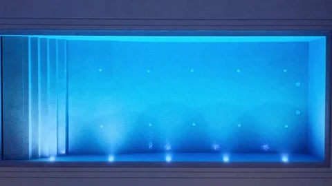 Descending drone view of modern rectangular swimming pool at night illuminated 스톡 동영상 321371646