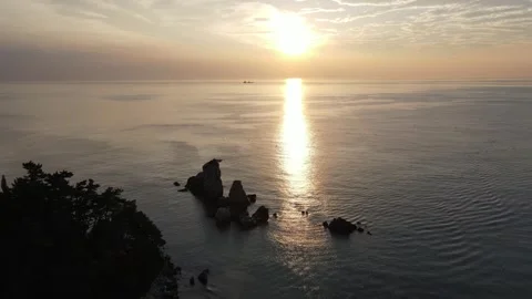 Descending Drone View Over Coastal Rocks at Sunrise Near Chotdaebawi, Korea Stock Footage 343194885
