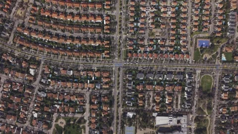 Descending drone view of palm lined intersection in Santiago Stock Footage 347342186