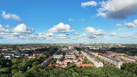 Descending drone view of park forest and The Hague city Stock Footage 344530991