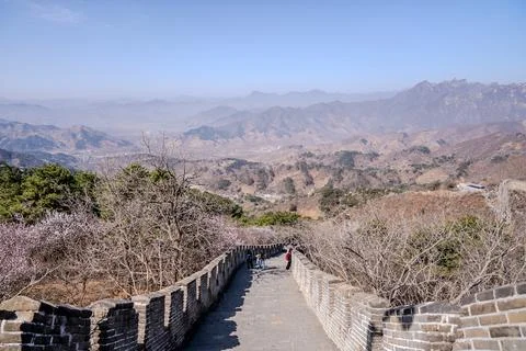 Descending Great Wall path into broad mountain valley Stock Photos