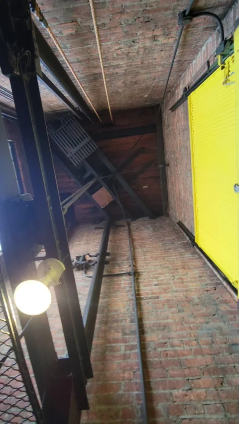 Descending in Old Elevator (Vertical Video) Video stock 196136988