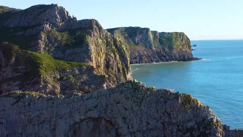 Descending Parallax Drone View of Dramatic Cliffs on Gower Coastline on Stock Footage 327496200