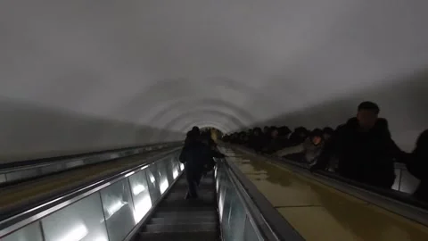 Descending into the Pyongyang Subway Stock Footage 325360255