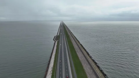 Descending shot centered on a car along the roadway Stock Footage 331838366