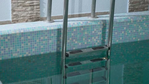 Descending the stairs to the pool 스톡 동영상 259574612