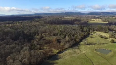 A descending view of a mountain valley in fall Stock Footage 336796985