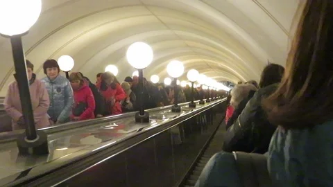 Descent and ascent on the escalator to the underground subway. Stock Footage 108023959