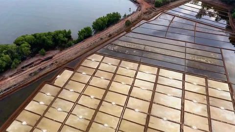 Descent from a bird's flight to the salt fields. Stock Footage 107451575