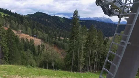Descent on a cable car. View from the ski lift in the mountains to the green 스톡 동영상 160538115