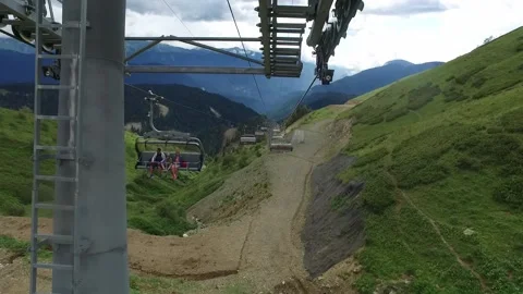 Descent on a cable car. View from the ski lift in the mountains to the green Stock Footage 164110723