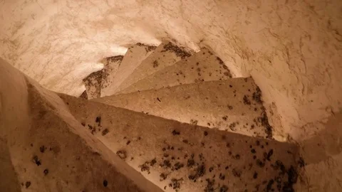 Descent down dropping covered concrete stairs Video stock 76463717