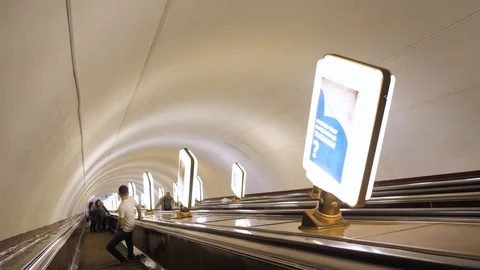 The descent down the long escalator in the metro. Stock Footage 124307017
