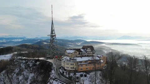 Descent drone view of steel framework tower and restaurant Uetliberg Zurich. Stock Footage 231154716
