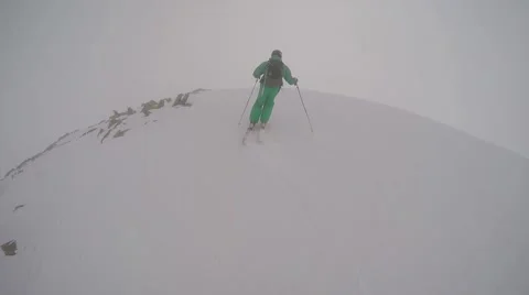 The descent from the high mountain skiing on fresh snow Stock Footage 55576211