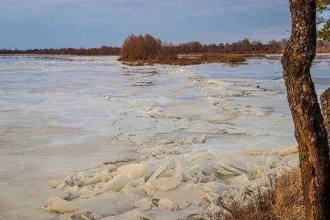 The descent of ice in the spring on the river in March is a natural phenomeno Stock Photos