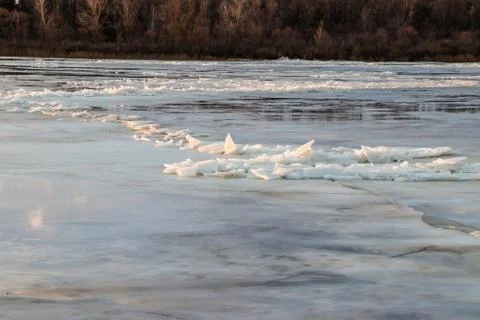 The descent of ice in the spring on the river in March is a natural phenomeno Stock Photos