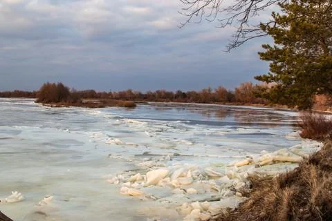 The descent of ice in the spring on the river in March is a natural phenomeno Stock Photos