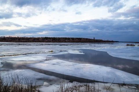 The descent of ice in the spring on the river in March is a natural phenomeno Stock Photos