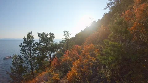 Descent on path of steep slope of sea shore on bright sunny autumn day Stock Footage 125538424