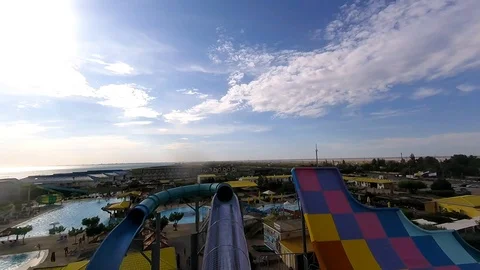 Descent from the plastic water slide in the water amusement Park Stock Footage 102364338
