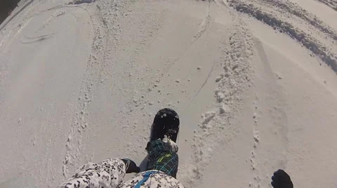 Descent on a snowboard first-person POV snowboarding Stock Footage