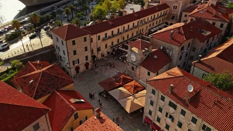 Descent to a Town Square Clock Tower With Cruise Ship Behind Stock Footage 345529618