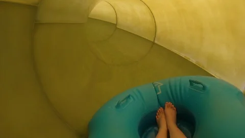 Descent from a yellow water slide Stock Footage 127007649