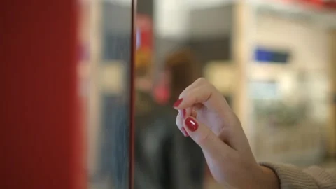 Describing the experience of engaging with a touchscreen kiosk in a lively Stock Footage 276589776