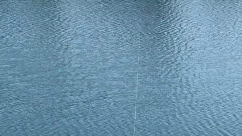 Description: Close-up view of a blue water surface with gentle natural ripples Stock Footage 342965233
