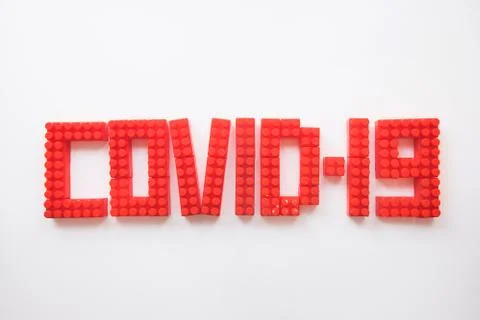 Description covid-19 of the constructor blocks on the white background Stock Photos