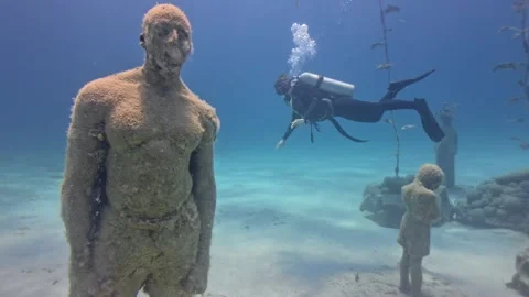 Description
Female Scuba Diver Exploring Submerged Human Statues at MUSAN Vídeo Stock 342068153