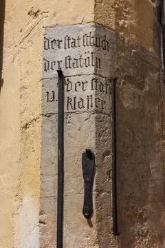Description of medieval measures of length on the wall of the town hall ("cit Stock Photos