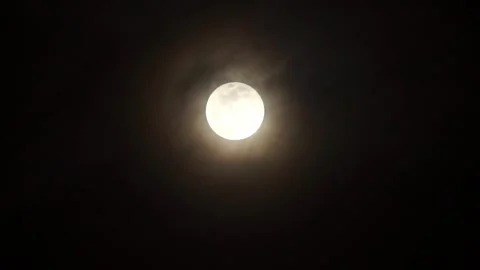 Description: Moon glowing through soft clouds in a peaceful night sky Stock Footage 346285041