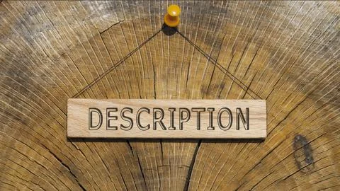 Description word. Written on wooden rectangular frame surface. Background log Stock Photos