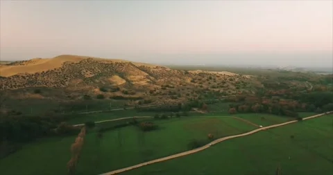 Desert and green fields Stock Footage 173434442