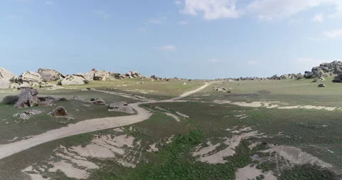 Desert area surrounded by rocks Stock Footage 262953399