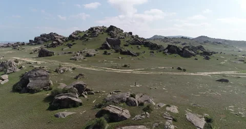 Desert area surrounded by rocks Stock Footage 262953455