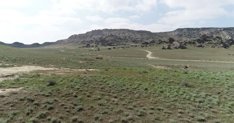 Desert area surrounded by rocks Stock Footage 262953800