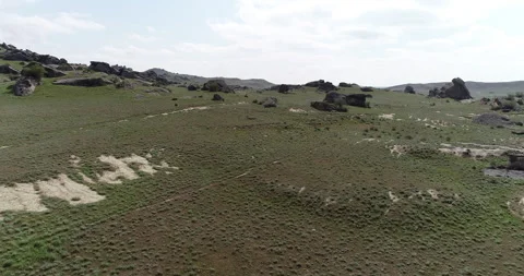 Desert area surrounded by rocks Stock Footage 262953847