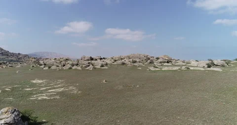 Desert area surrounded by rocks Stock Footage 262954535